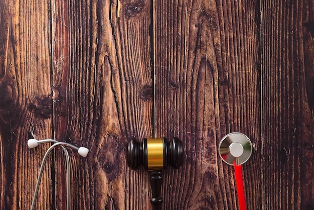 A gavel striking a sound block in a courtroom, symbolizing legal repercussions and enforcement actions.