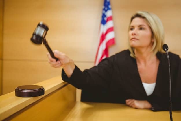 A gavel striking a sound block in a courtroom, with the US flag blurred in the background, representing legal challenges to healthcare laws.