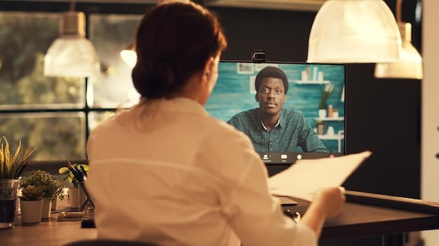 A team leader in the US conducting a virtual performance review with a remote team member. The scene depicts a professional and supportive environment, with the leader providing constructive feedback and discussing goals. A performance dashboard is visible in the background.