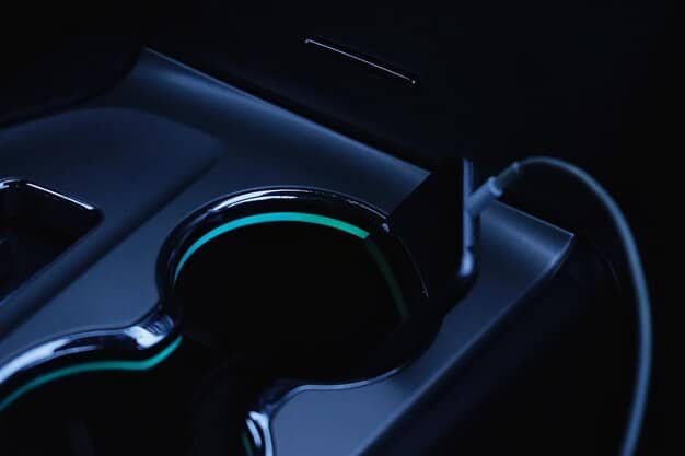 A close-up shot of a futuristic wireless charging pad in operation. An electric vehicle is parked above the pad, receiving charge wirelessly, with a digital display showing the charging progress and energy transfer rate.