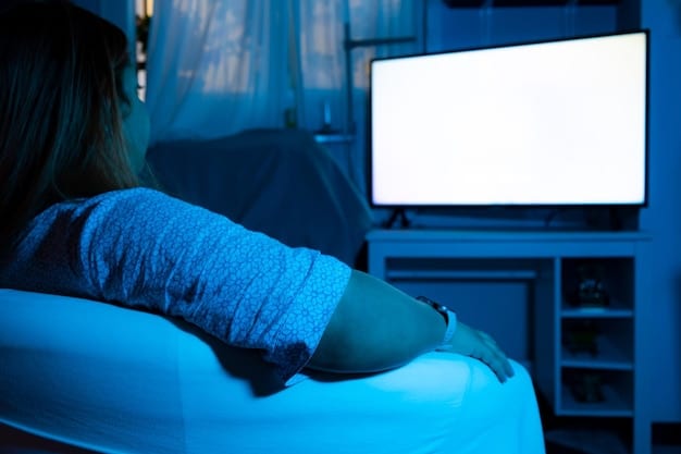 A person's hand holding a remote control, pointing it at a glowing TV screen displaying an old, black-and-white television show, with a cozy living room in the background.
