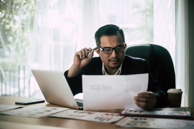 A businessman looking intently at a financial spreadsheet with a worried expression, reflecting the uncertainty surrounding tax policy changes.