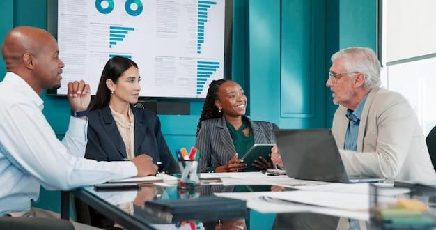 A diverse group of business professionals in a boardroom discussing financial data sheets, illustrating collaborative decision-making in response to economic policy.