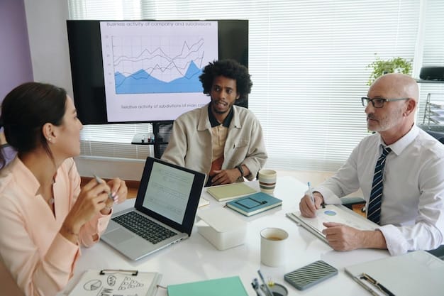 A diverse group of professionals brainstorming around a table, reviewing charts and financial projections, with a focus on adapting to potential tax law changes, highlighting the importance of planning when considering 'Is the Corporate Tax Rate Really Dropping to 21% in 2025? What Businesses Need to Know Now'.