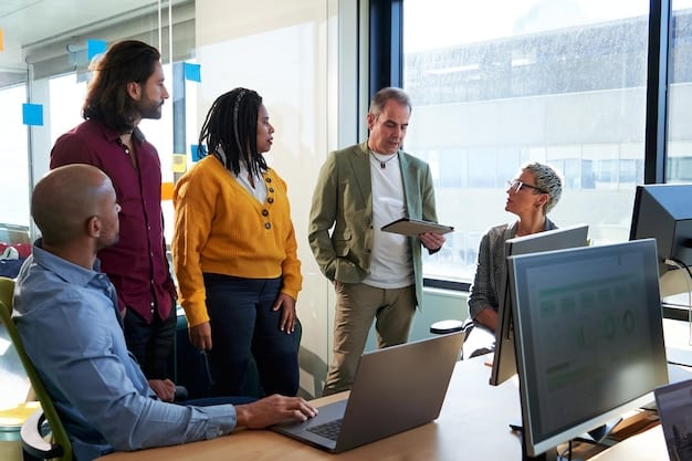 A diverse group of professionals collaborating on a digital project in a modern office. They are using various devices, including laptops and tablets, showcasing their adaptability to new technologies. This scene exemplifies the collaboration skills necessary to thrive amidst 'Insider Analysis: The Impact of Automation on the Workforce - What Skills Are in Demand?'.