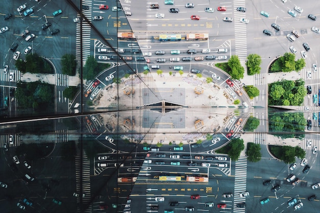 An aerial view of a futuristic smart city, showcasing interconnected buildings, autonomous vehicles, and data streams forming a neural network, with overlayed icons representing public safety and environmental sensors.