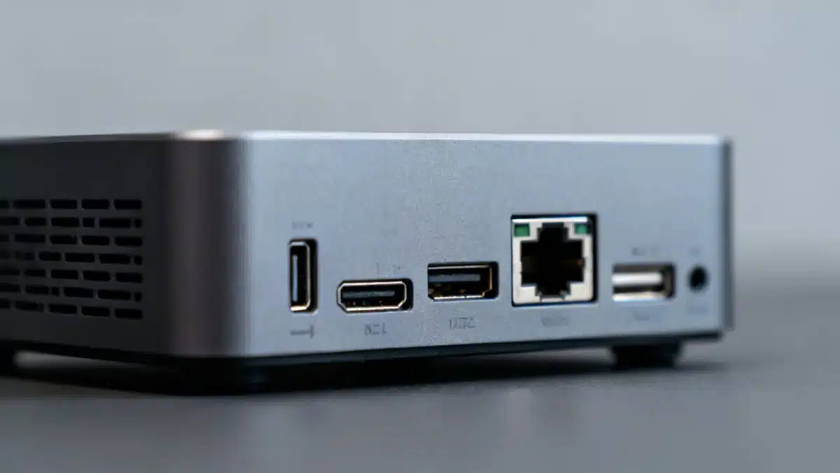Detailed view of mini PC's rear ports, emphasizing connectivity and compact design for modern computing needs.