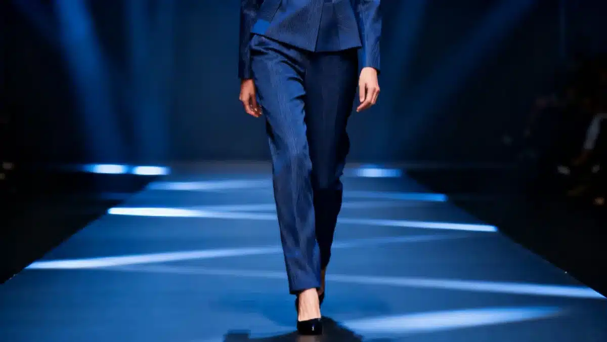 Model wearing a deep blue outfit from the Color Palette Forecast 2026 collection.